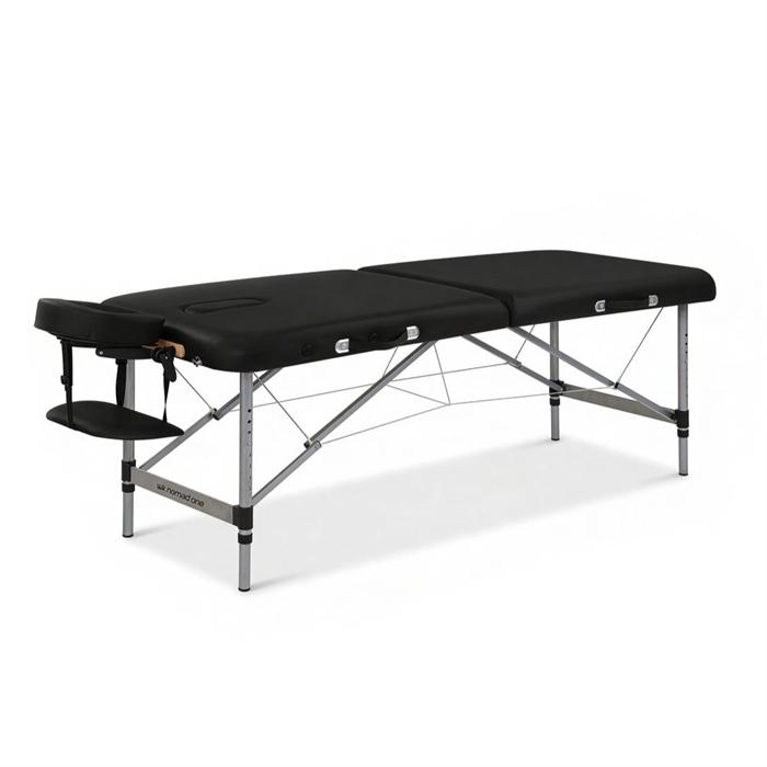 Transportabel massagebriks med sort aluminiumsstel, armlæn og ansigtshul